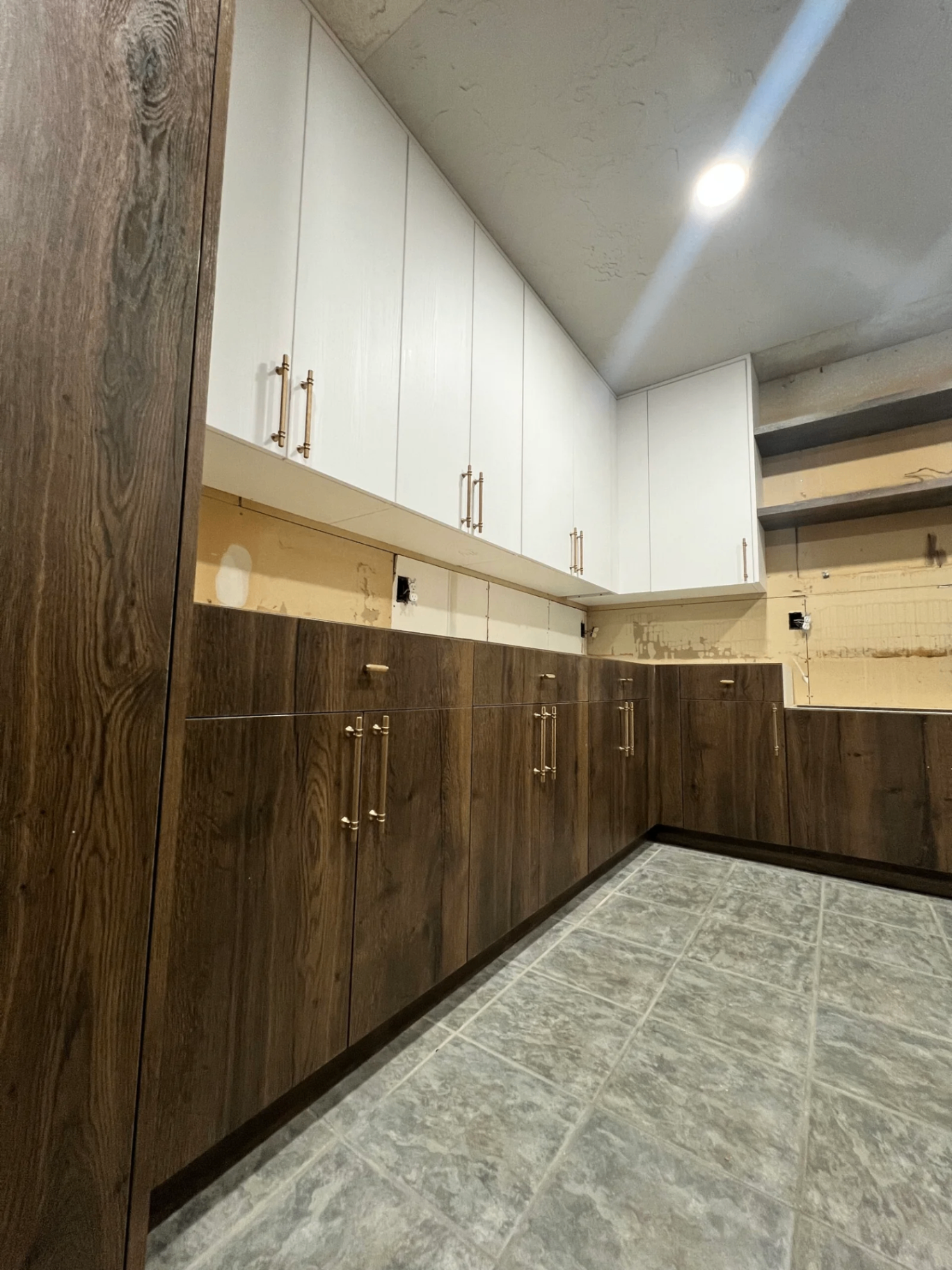 Custom cabinetry with brass hardware